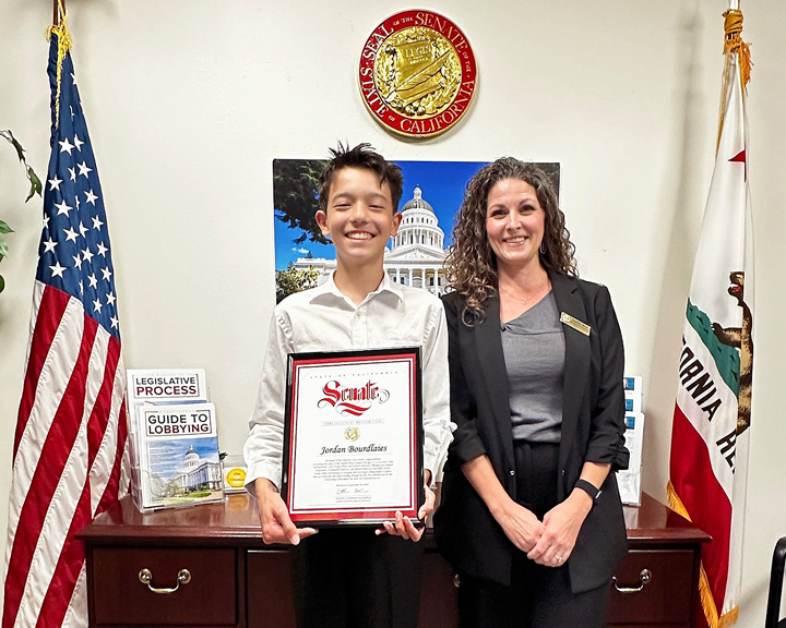 Jordan accepting K. Blakespear commendation